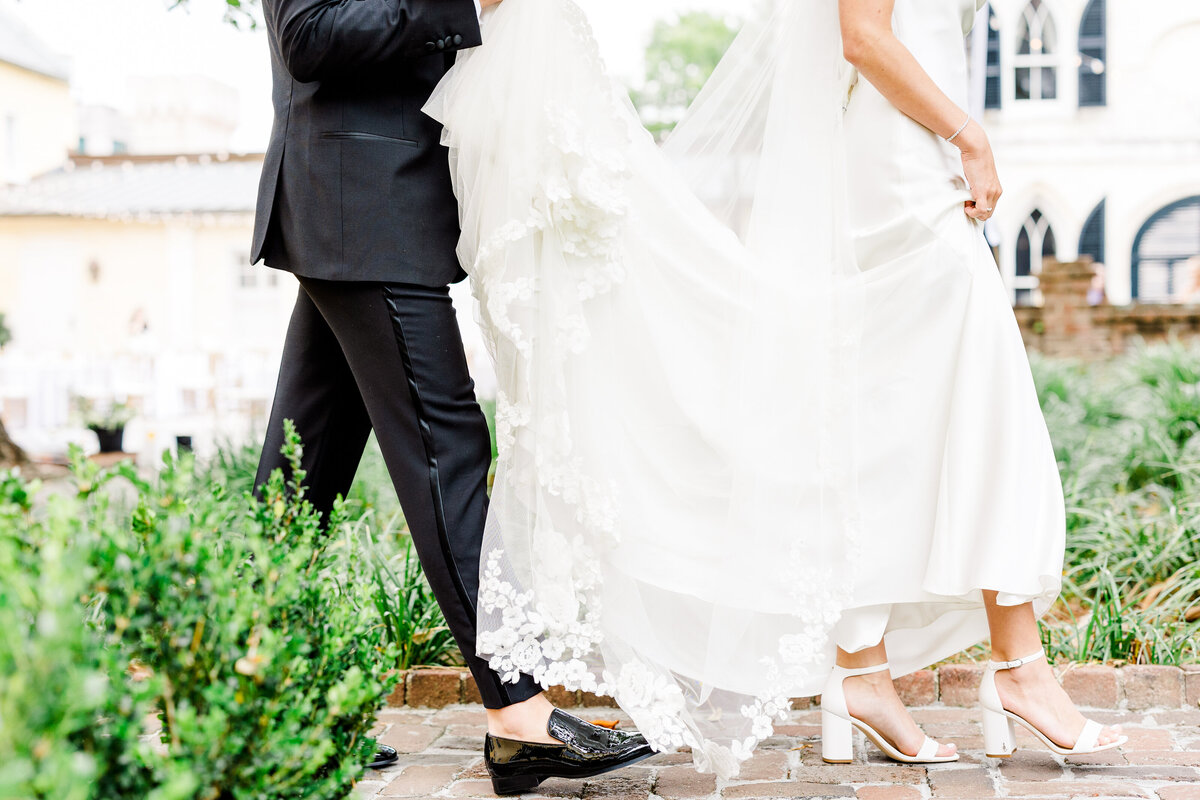 bride and groom walking at the william aiken house