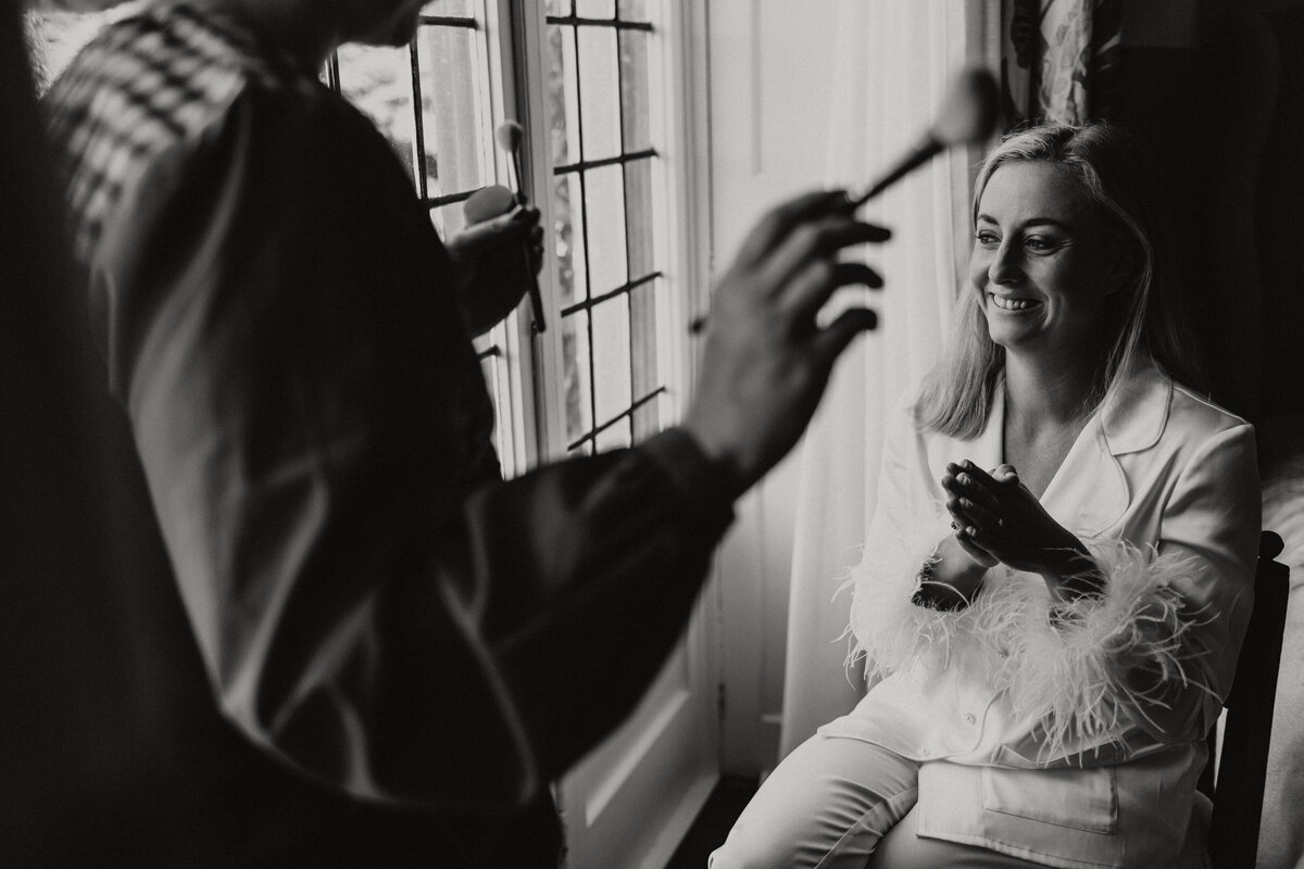 Bride having make up applied 