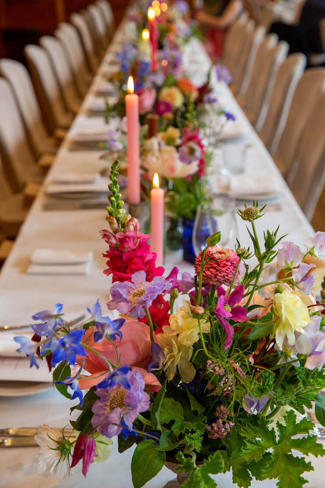 Flowers on wedding breakfast table in Bethal Hall , Town Hall Hotel London