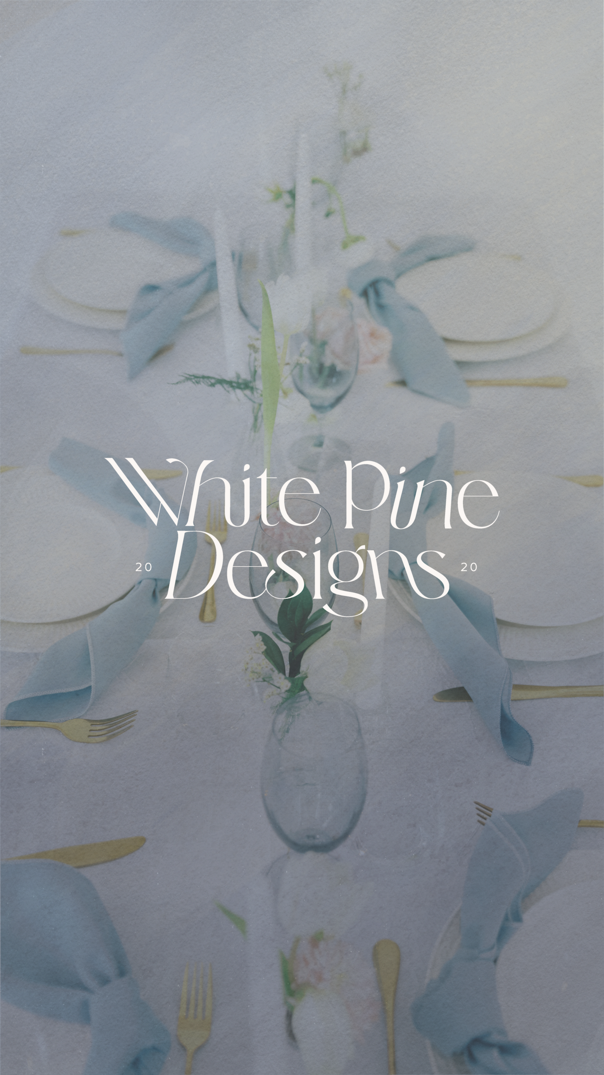 White Pine Designs logo on top of an image of a blue themed tablescape