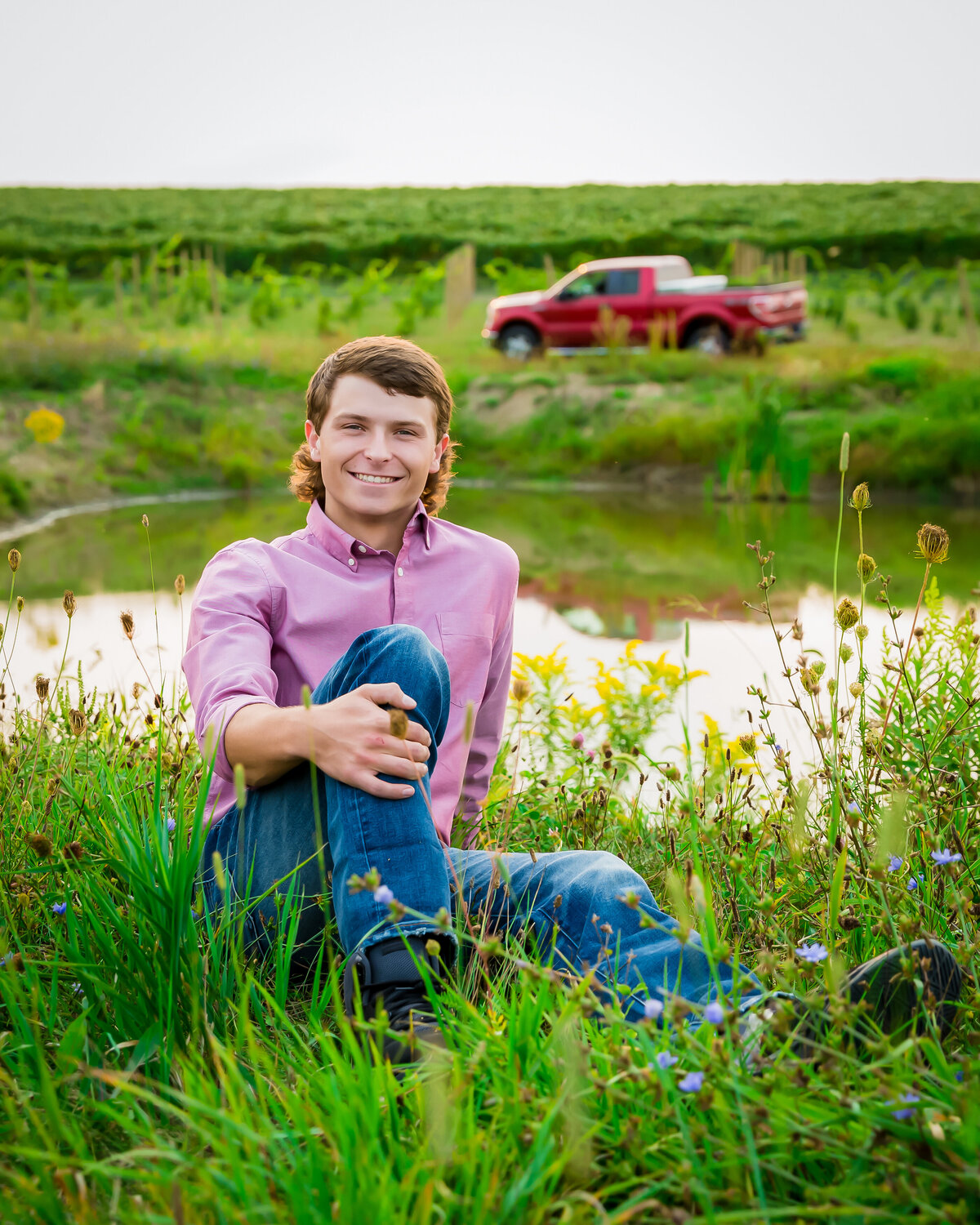 Picture of senior guy by a pond with his truck on a farm in Penn Yan, NY