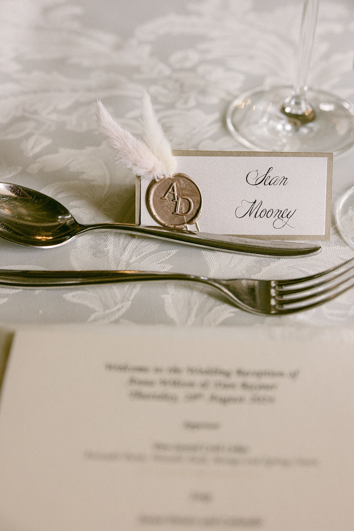 A wedding day photo of the dinner menu in the reception hall at Luttrellstown Castle