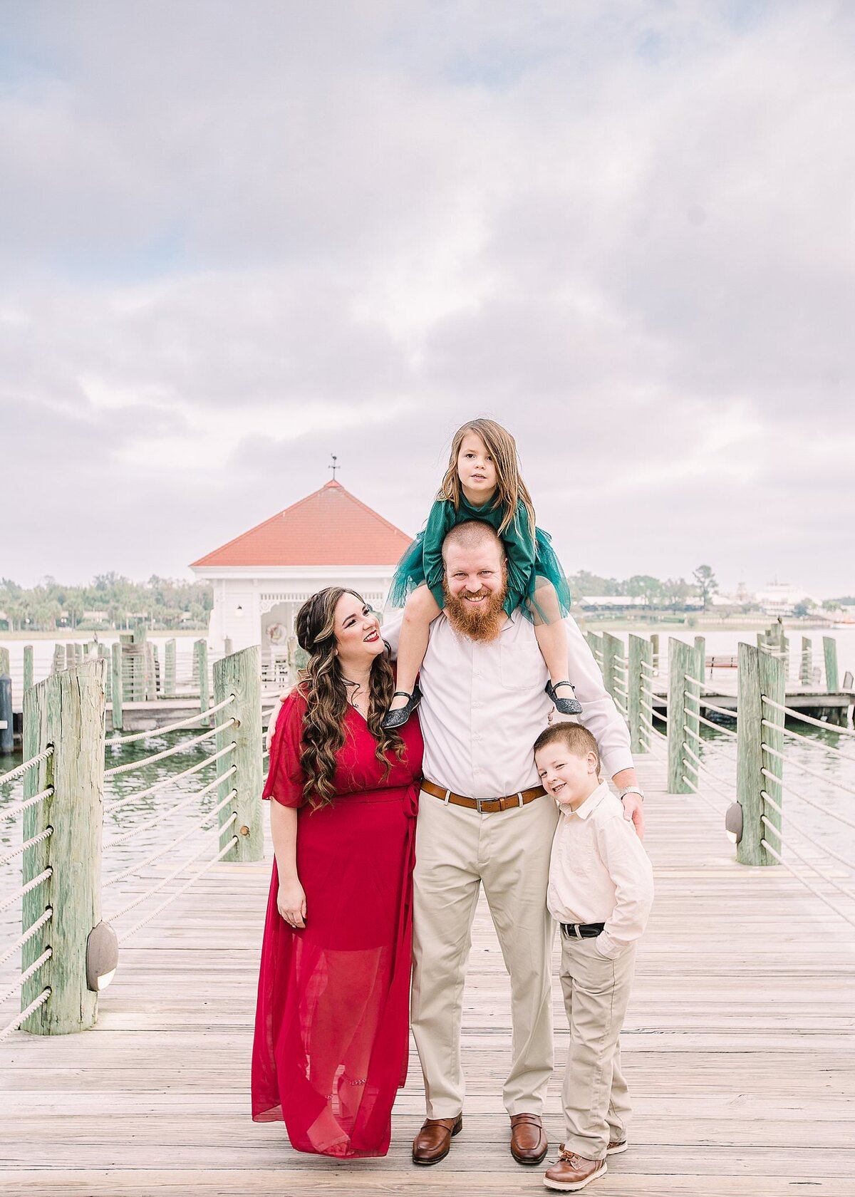 Family photo at Disney's  Grand Floridian Resort with dad holding his little girl on his shoulders