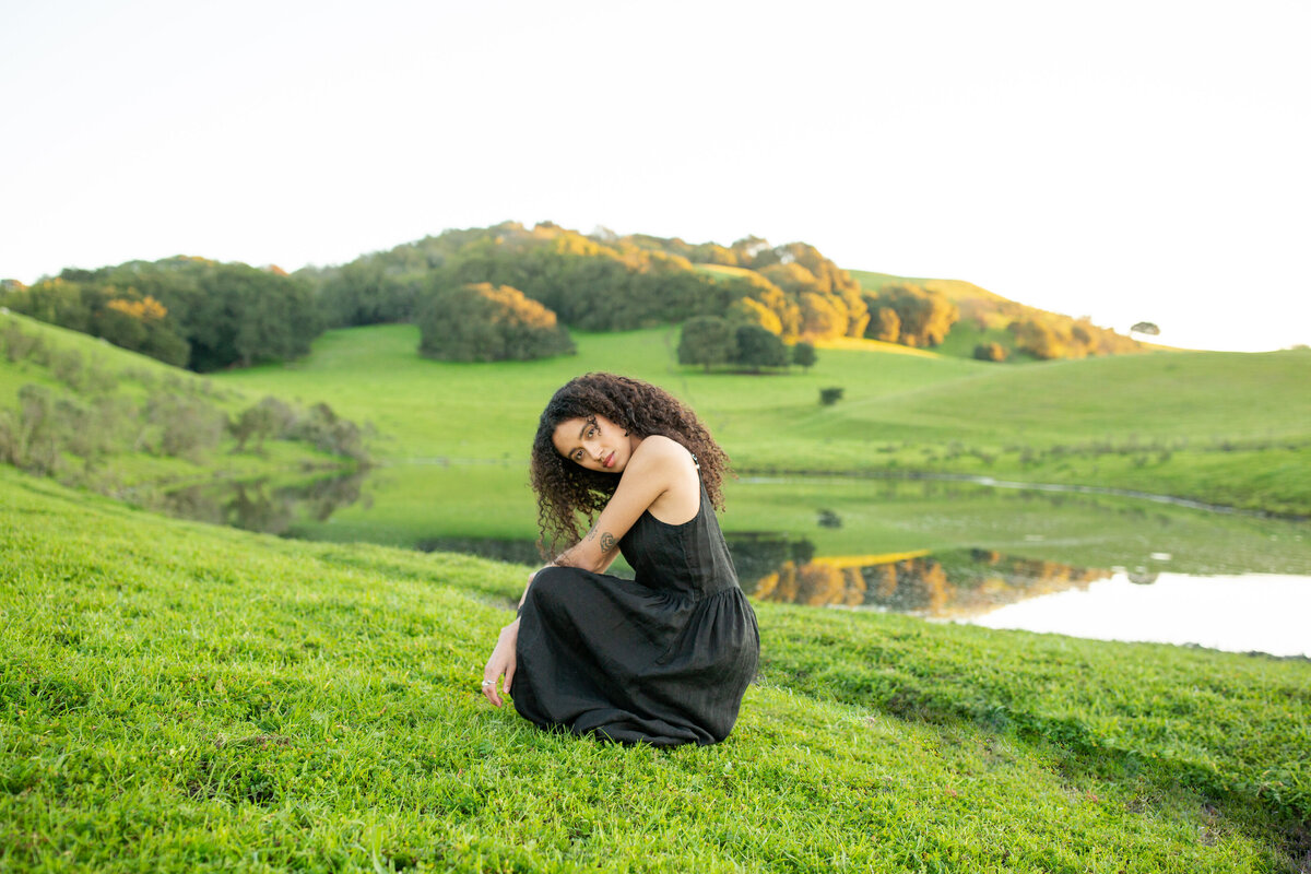 woman kneeling down in a countryside