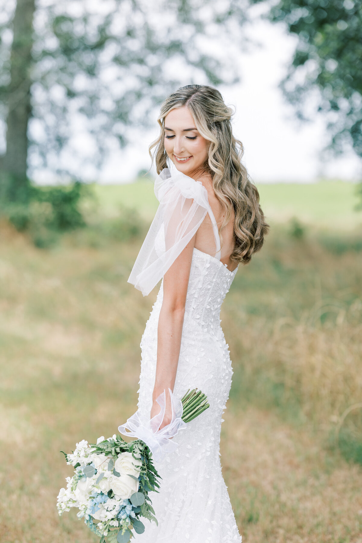 a bride posing in her wedding dress