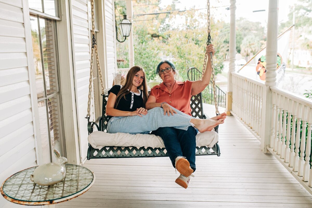 grandmother and granddaughter on swing in Pensacola