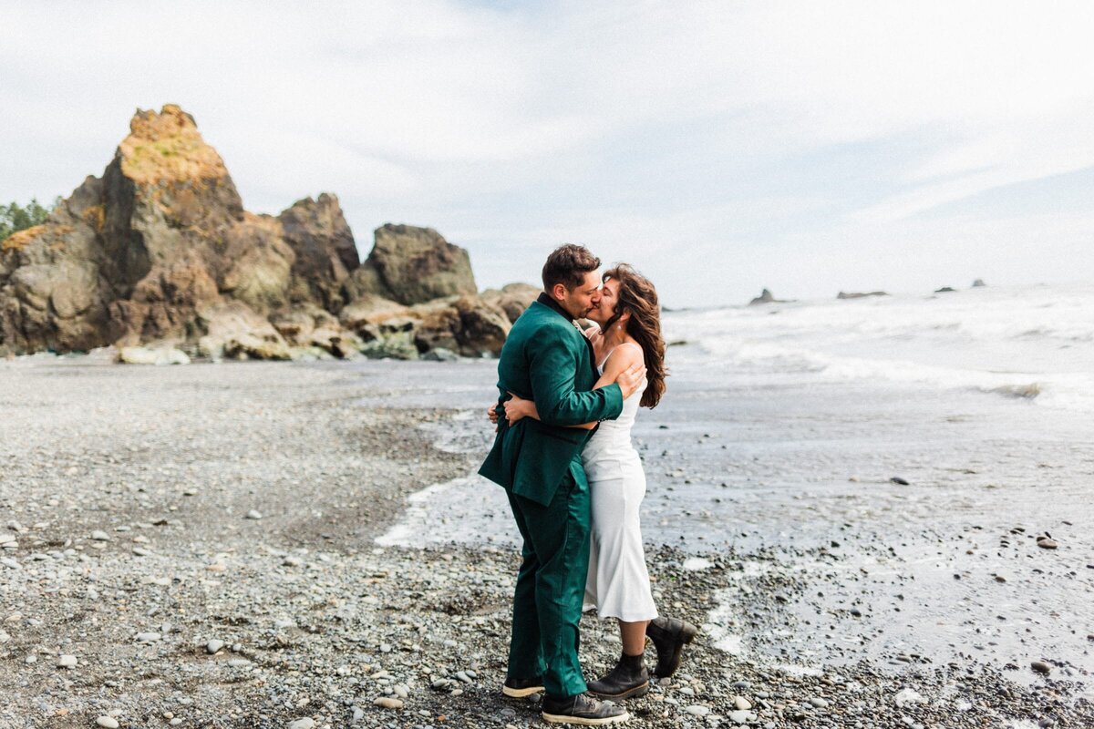 Olympic National Park Elopement at Ruby beach with the tide coming in.