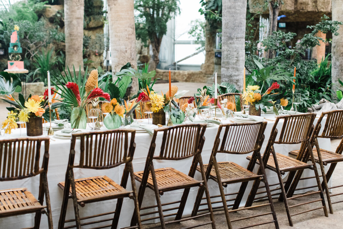 tropical themed table settings at wedding reception