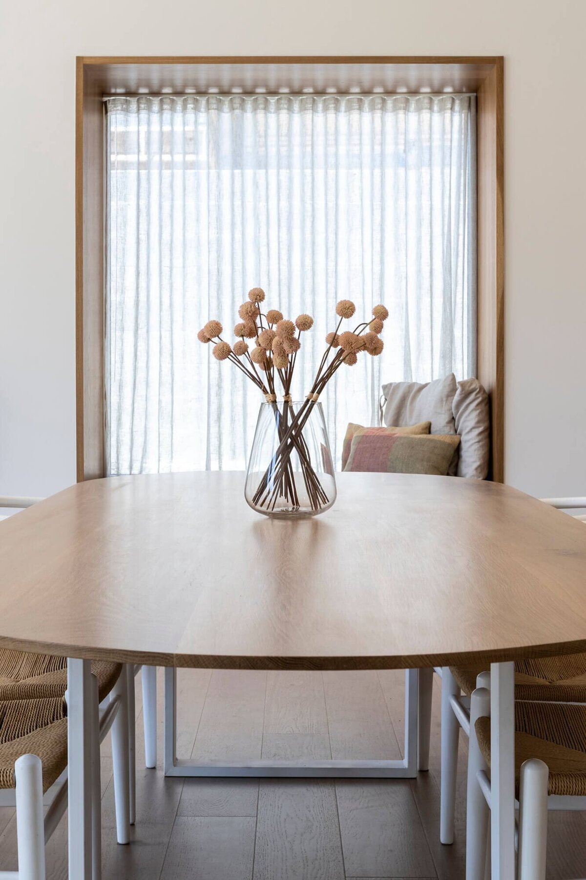 Kitchen table with cotton in a vase