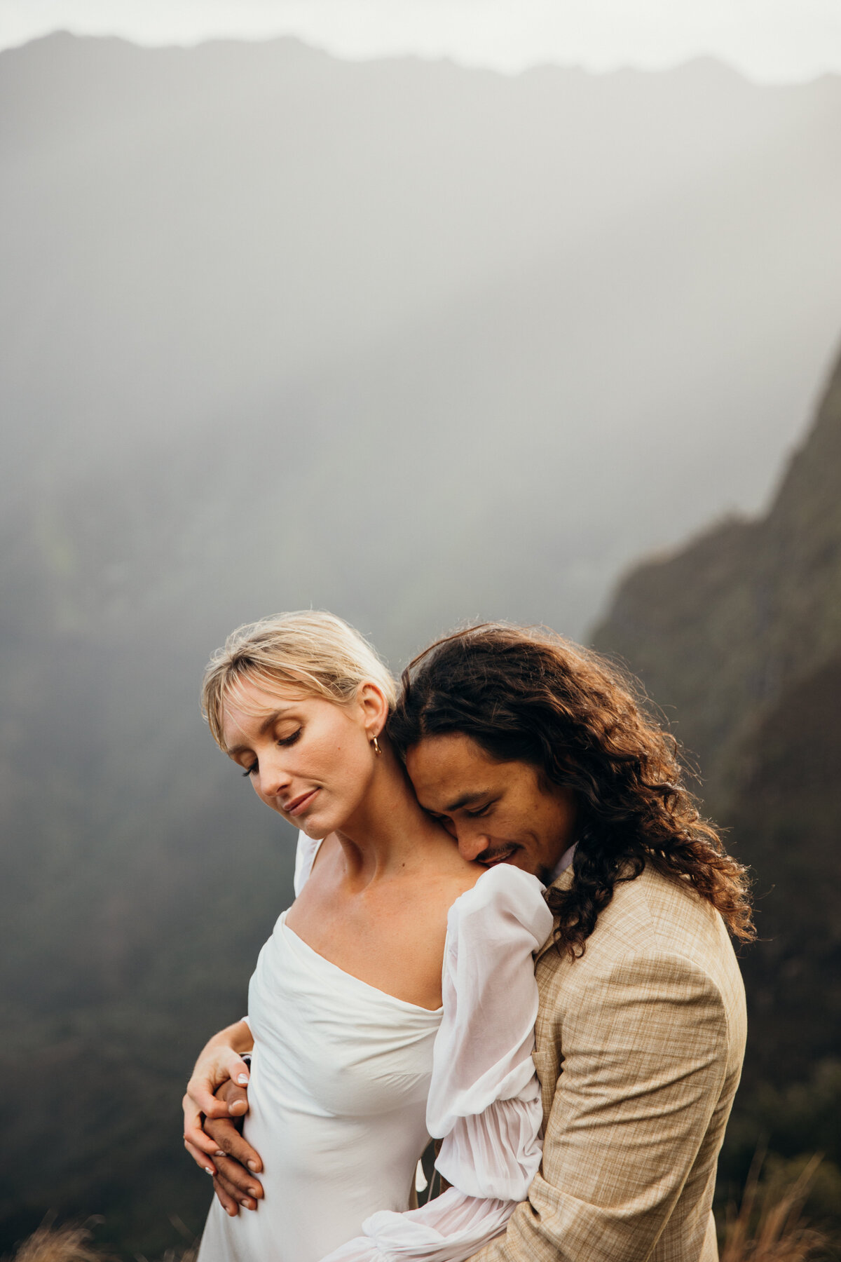 Maui Wedding Photographer captures groom resting head on bride's shoulder