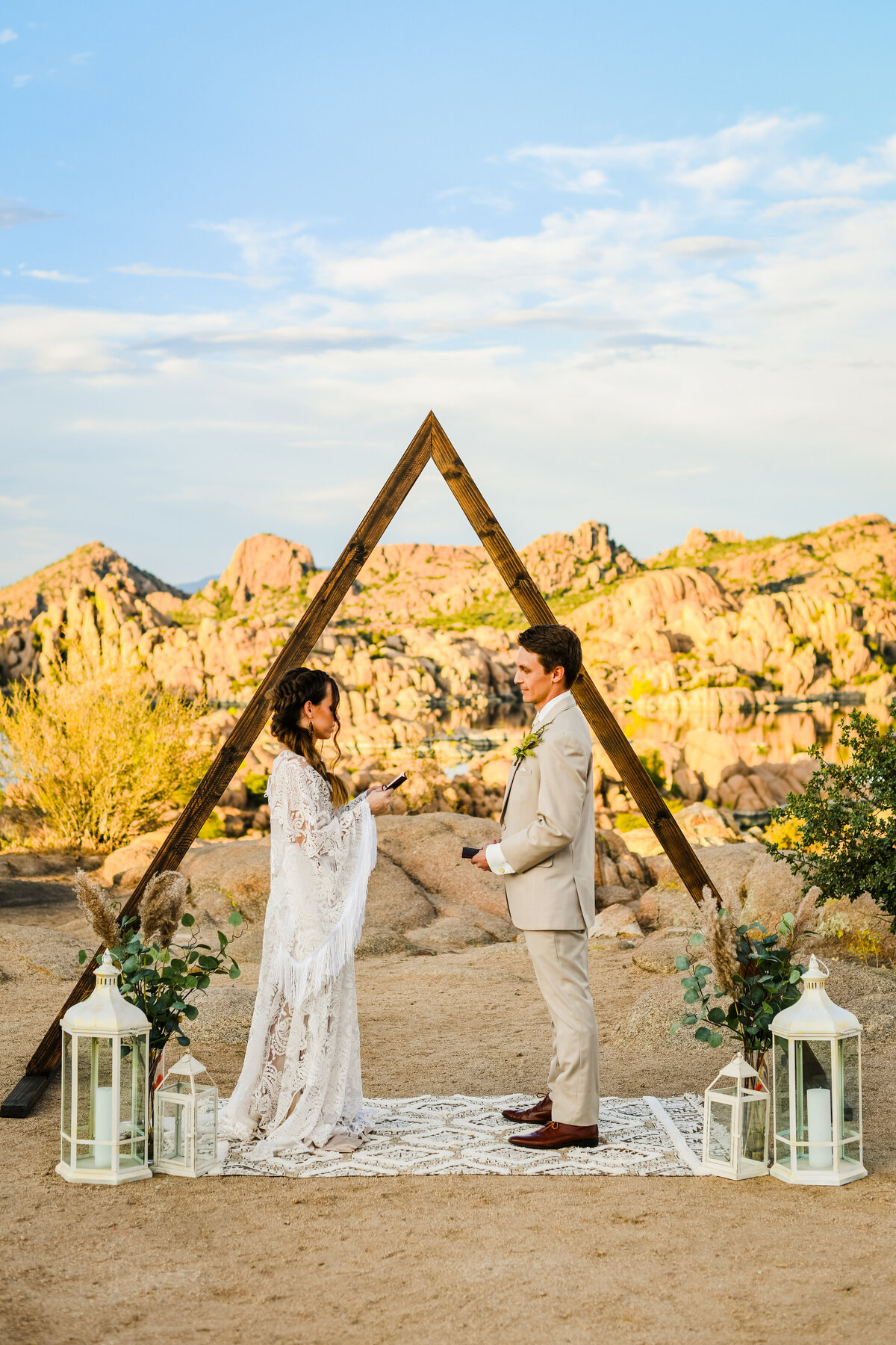 Bride and Groom reading vows arch Watson Lake Prescott elopement wedding