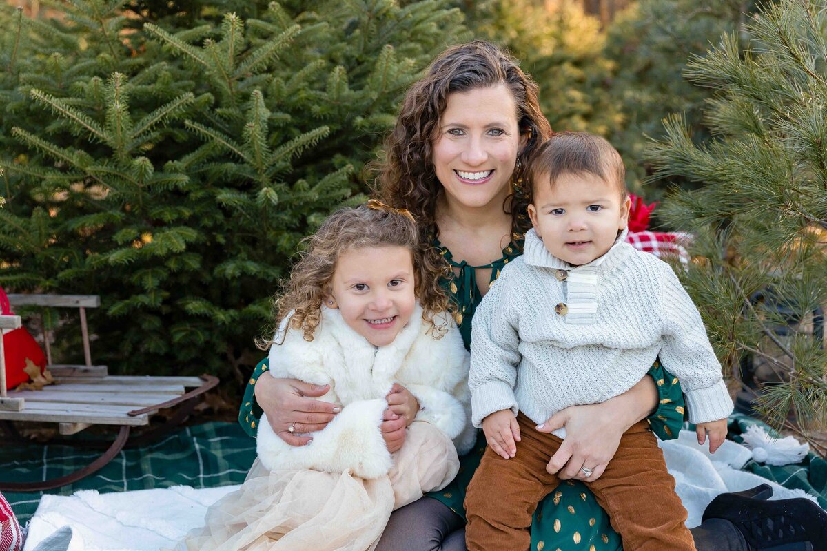 mom and toddlers on christmas tree farm