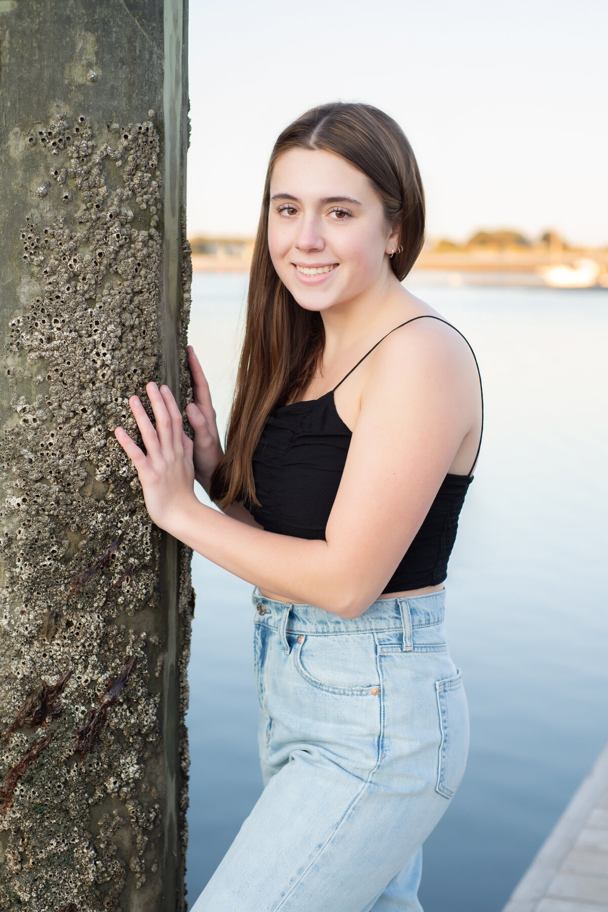 High School Senior on Dock at Harbor Beach in Wells Maine