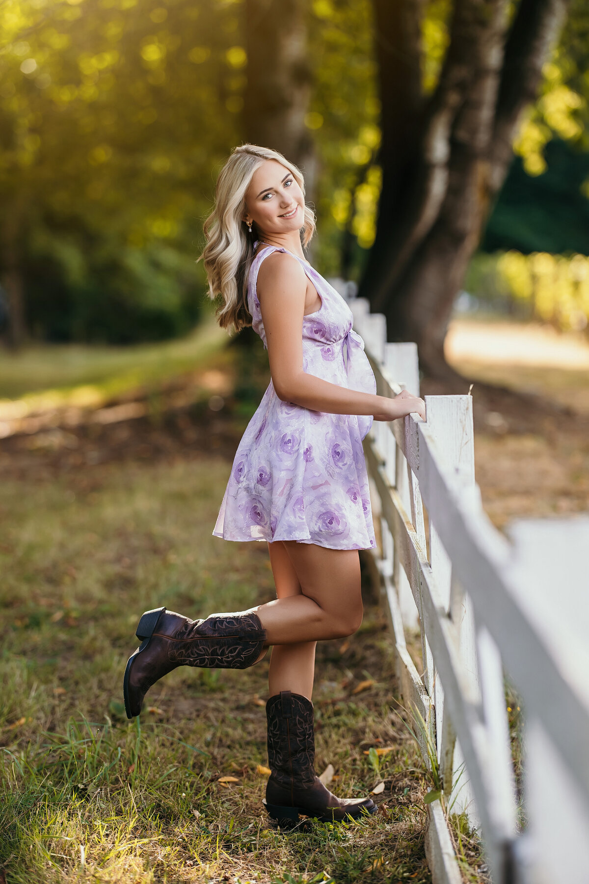 senior girl in summer dress with cowboy boots