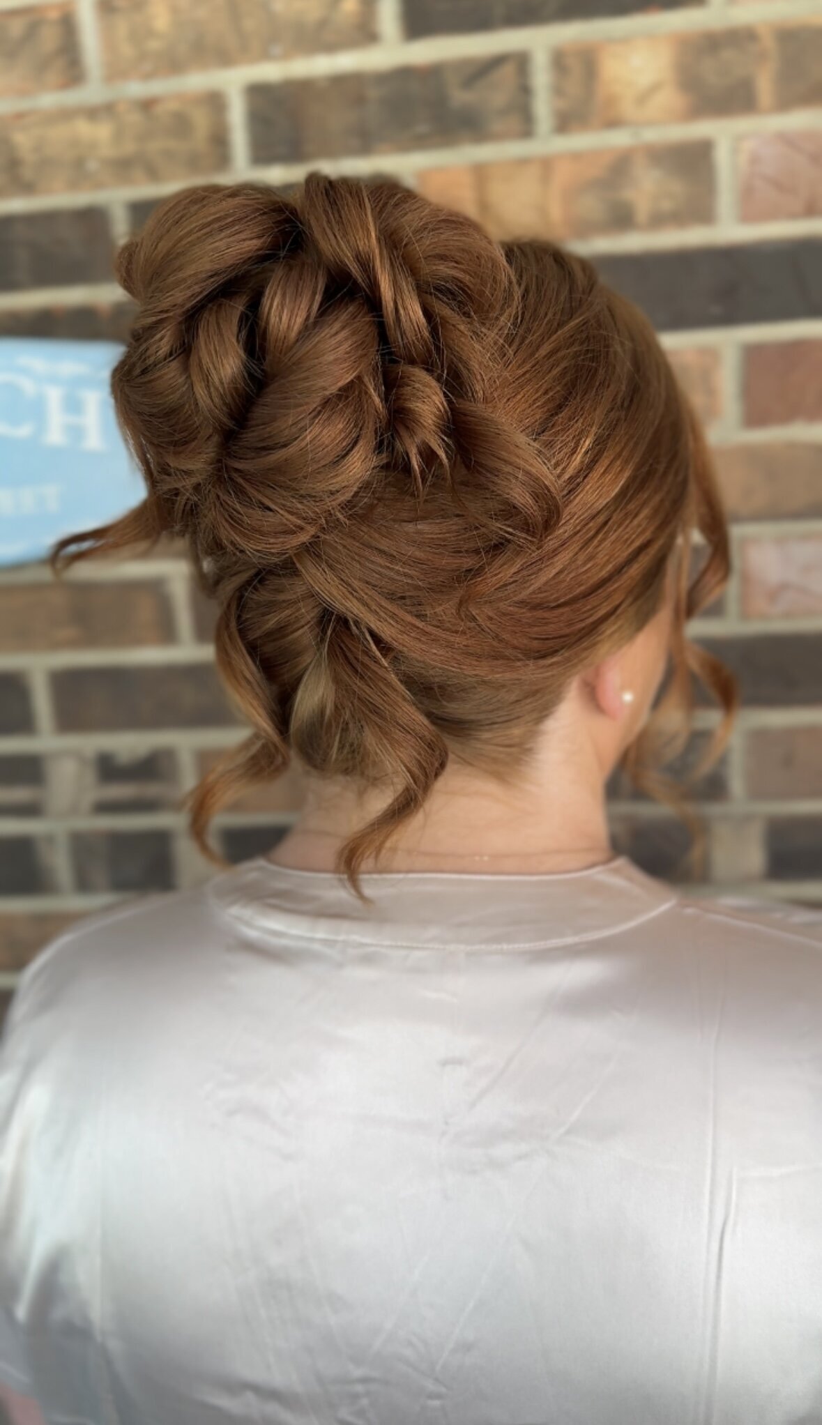messy high updo on red hair Nashville wedding hairstylist