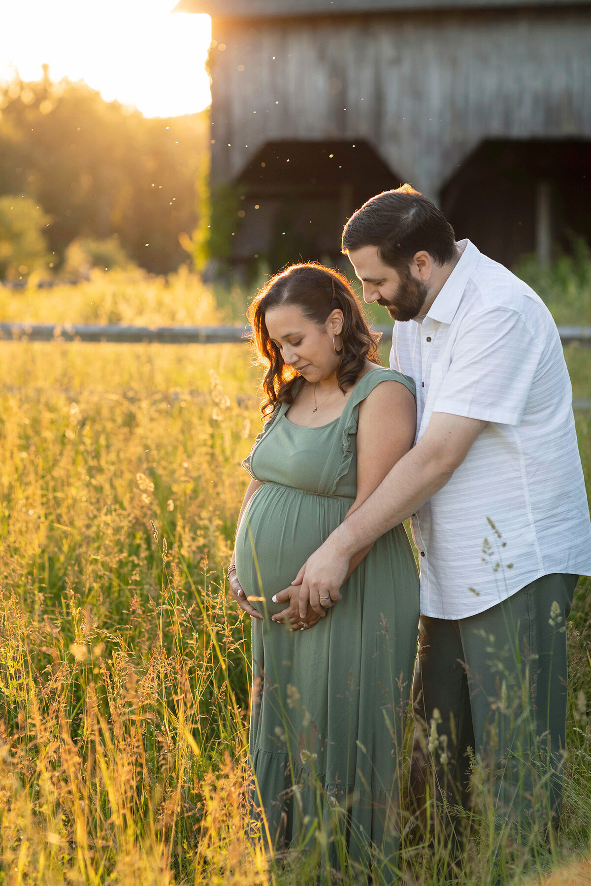 NJ Maternity photographer captures mom and dad gazing at belly