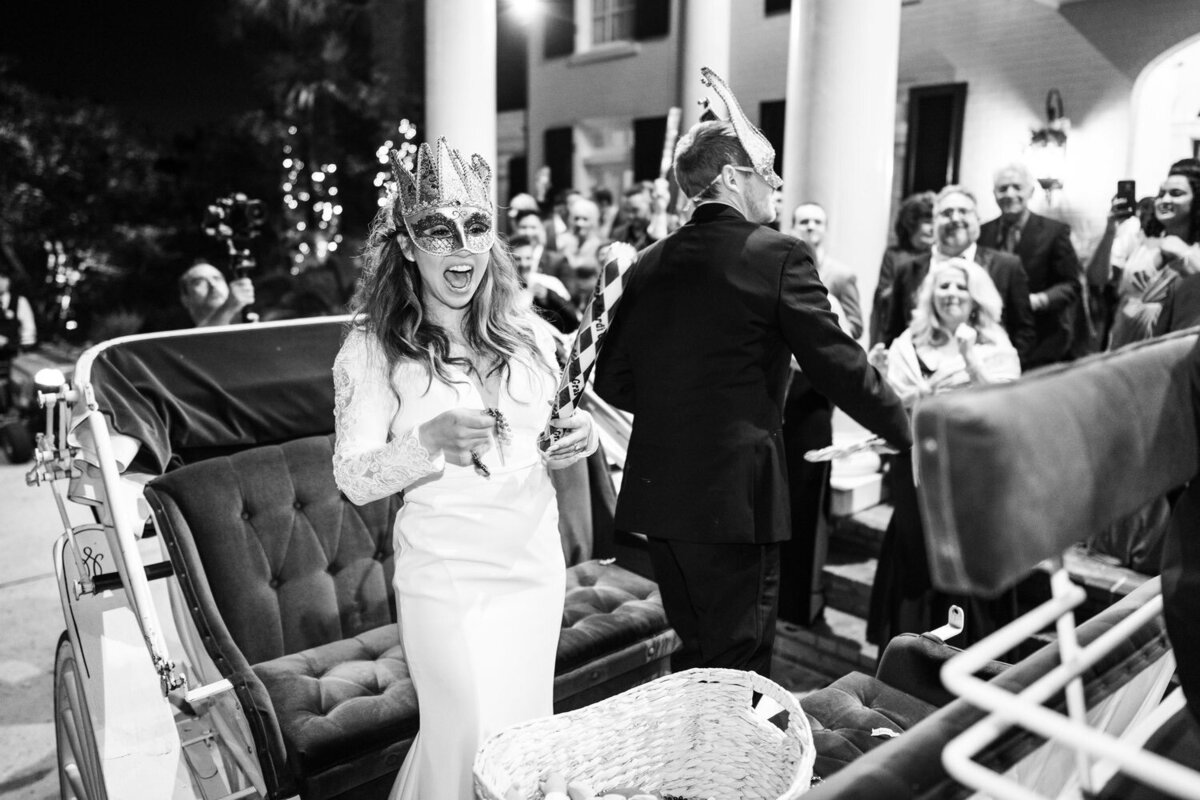 Bride and groom throwing beads at Southern Oaks wedding parade