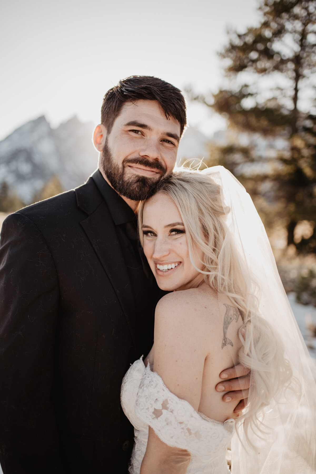 Jackson Hole Photographers capture couple smiling and hugging after elopement