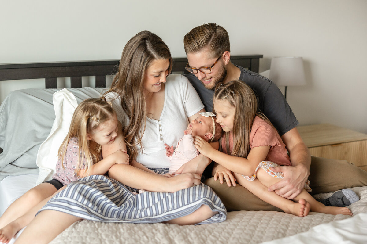 parents looking at their newborn