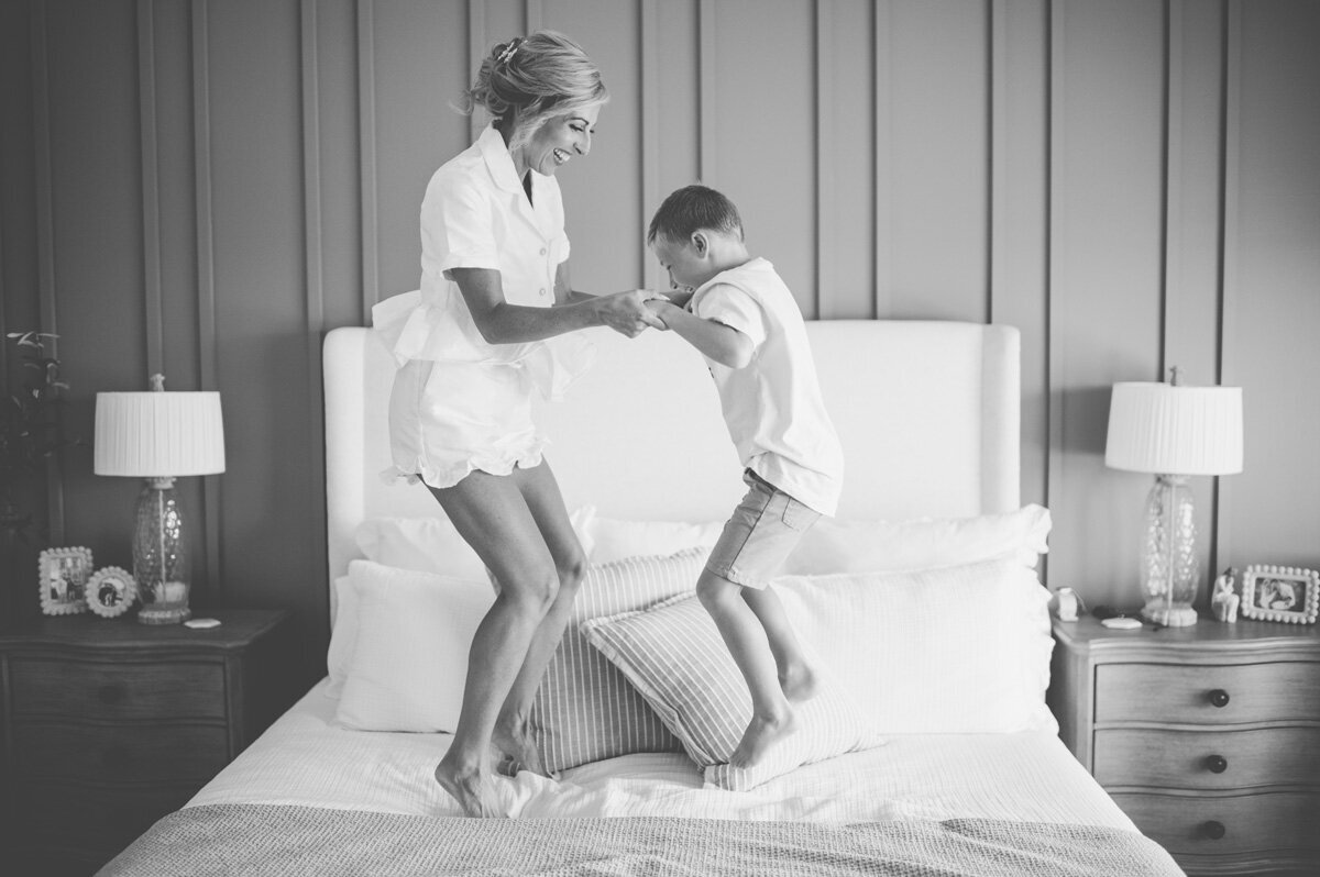Bride jumping with her son
