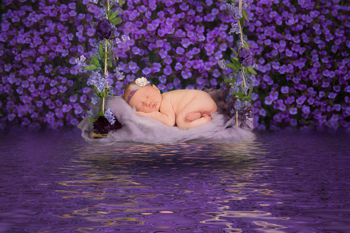 Newborn nestled in a lavender field-inspired setup, captured in Overland Park, Kansas. Ideal for families looking for serene and creative newborn photography in the Kansas City area.
