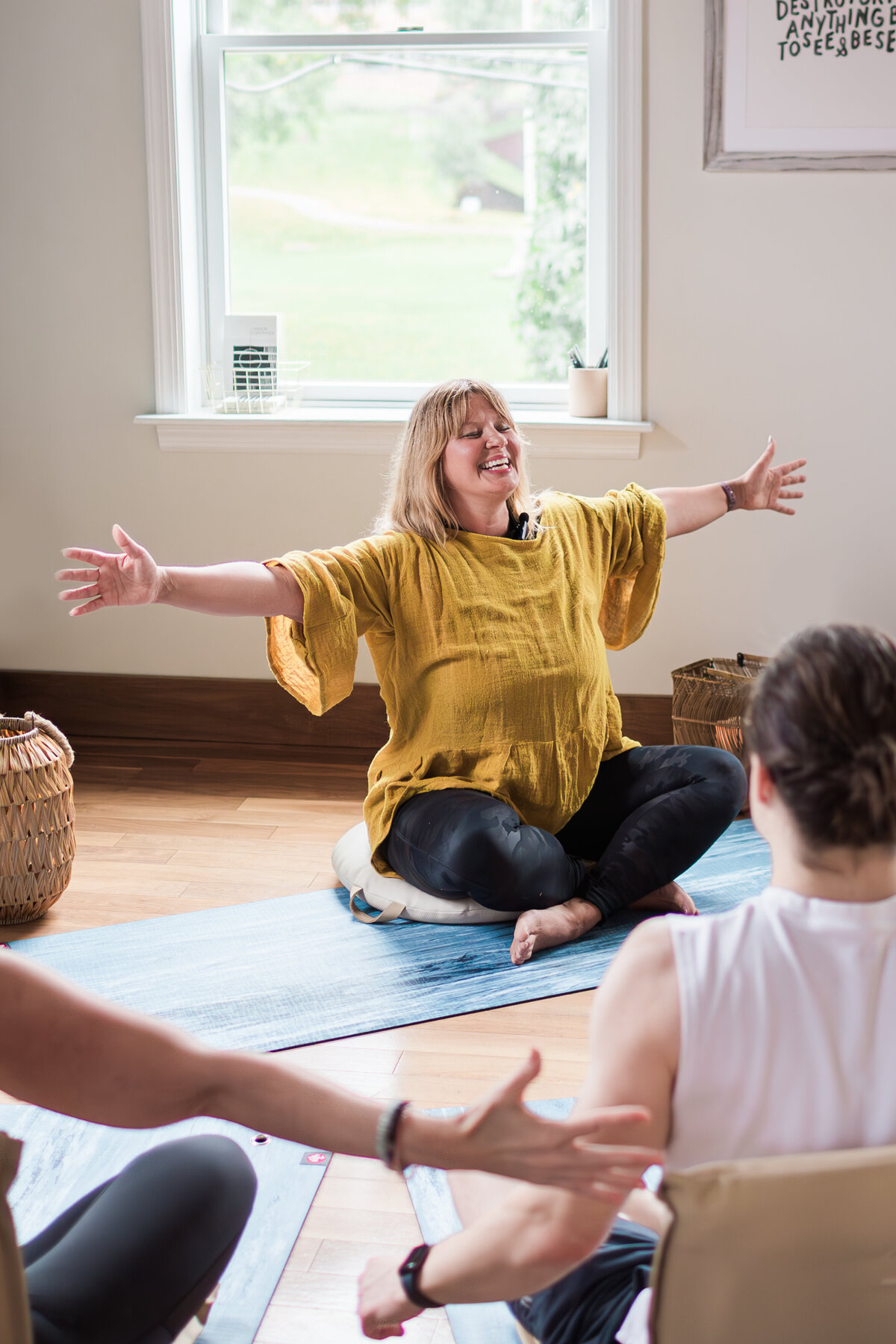 embodiment teacher leads class with arms wide open