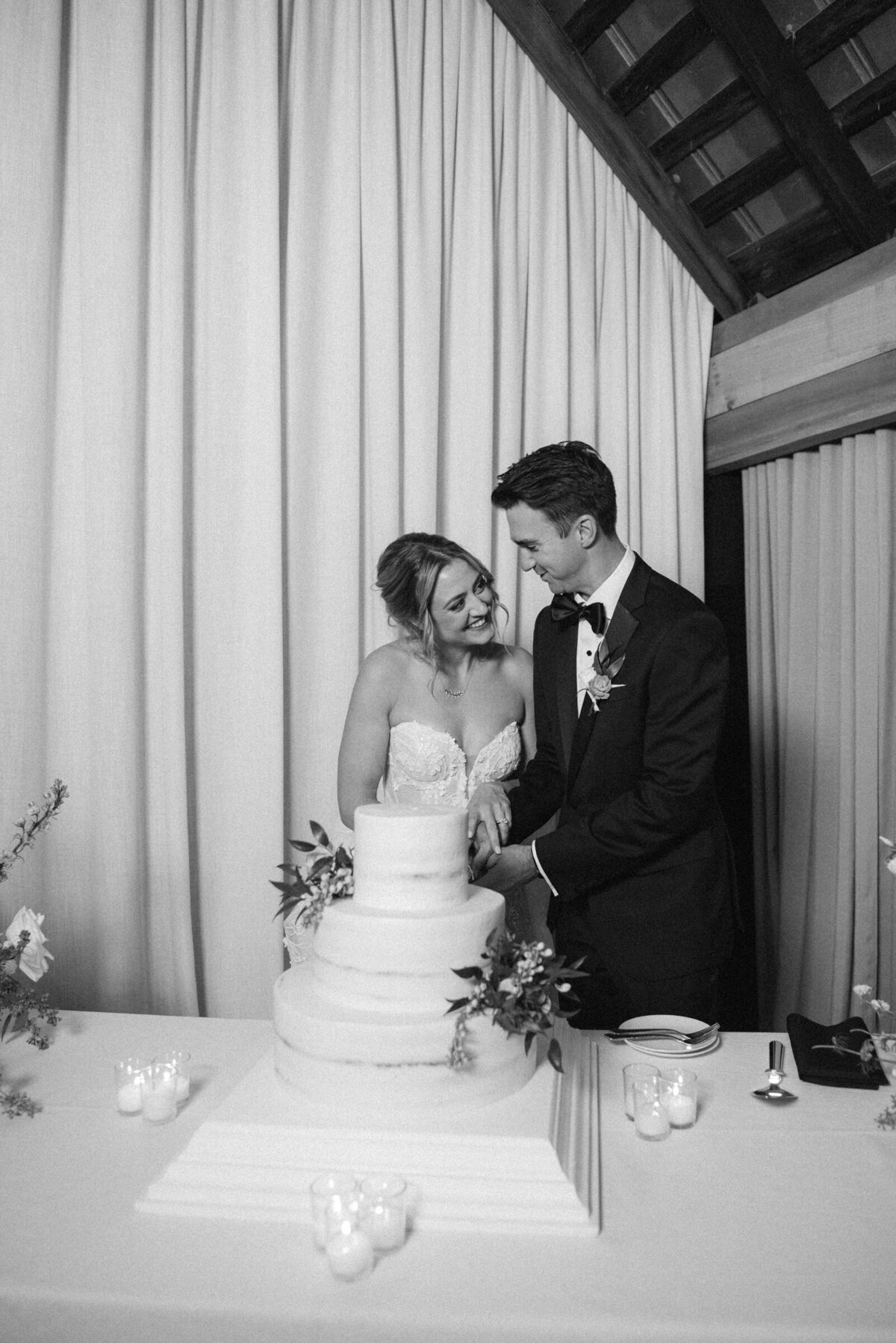 bride and groom cutting cake at Barn 8 Hermitage Farm wedding