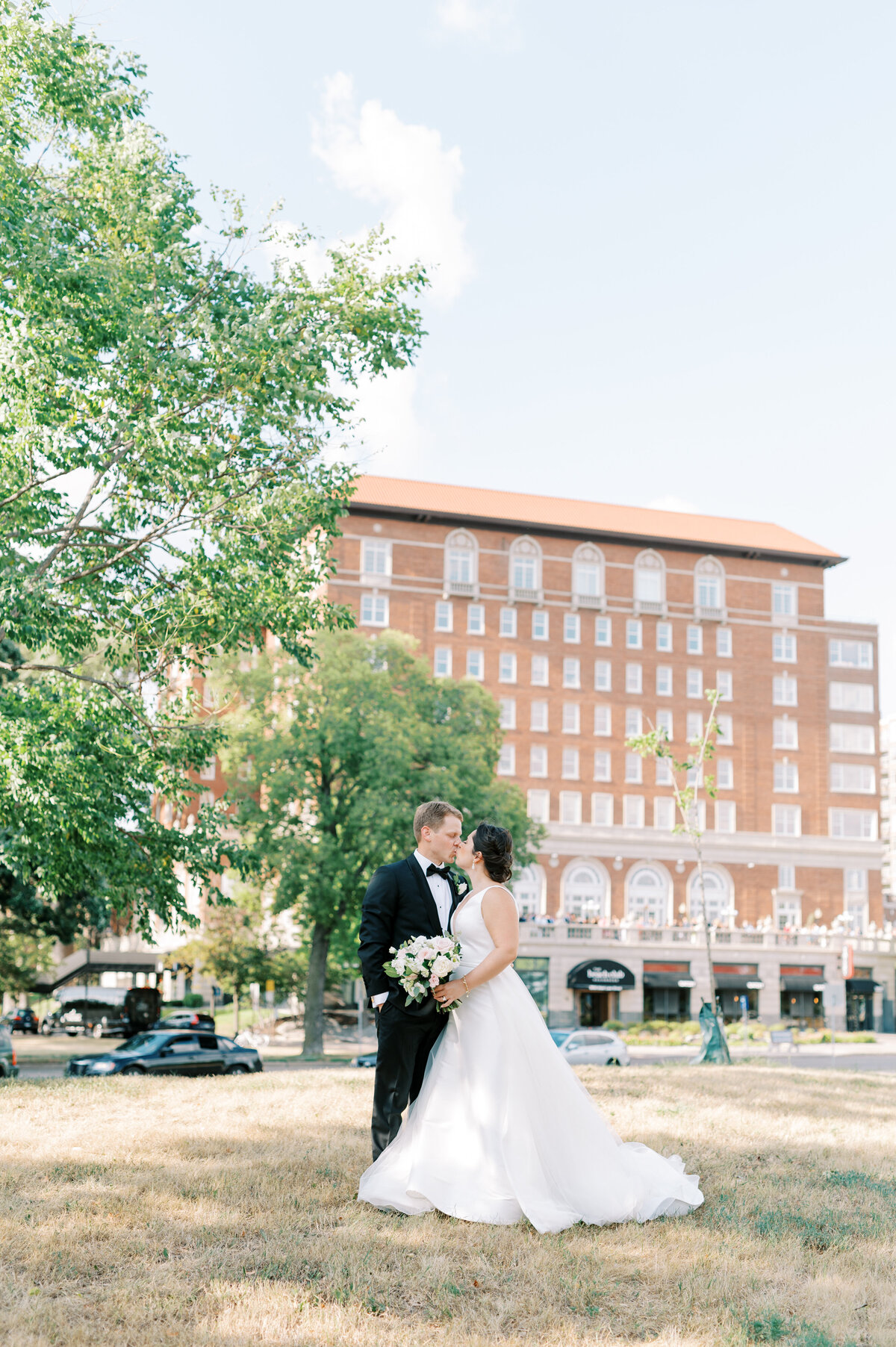 Bride and groom kissing outside the Beach Club in Minneapolis