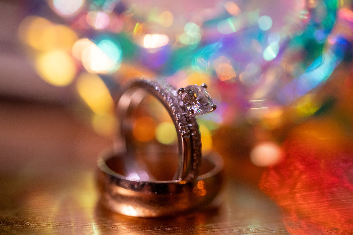 Close up of wedding rings with a colorful background