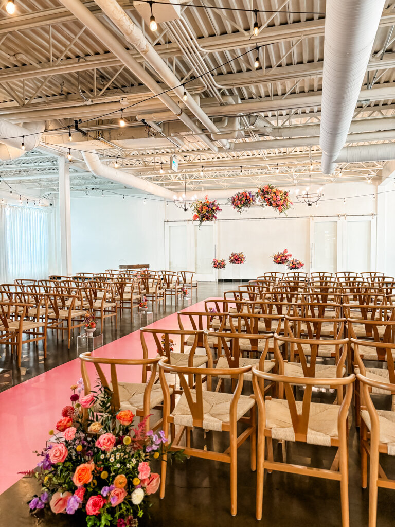 Bright and colourful wedding ceremony at The Brownstone, modern and elegant Calgary, Alberta wedding venue, featured on the Brontë Bride Vendor Guide.