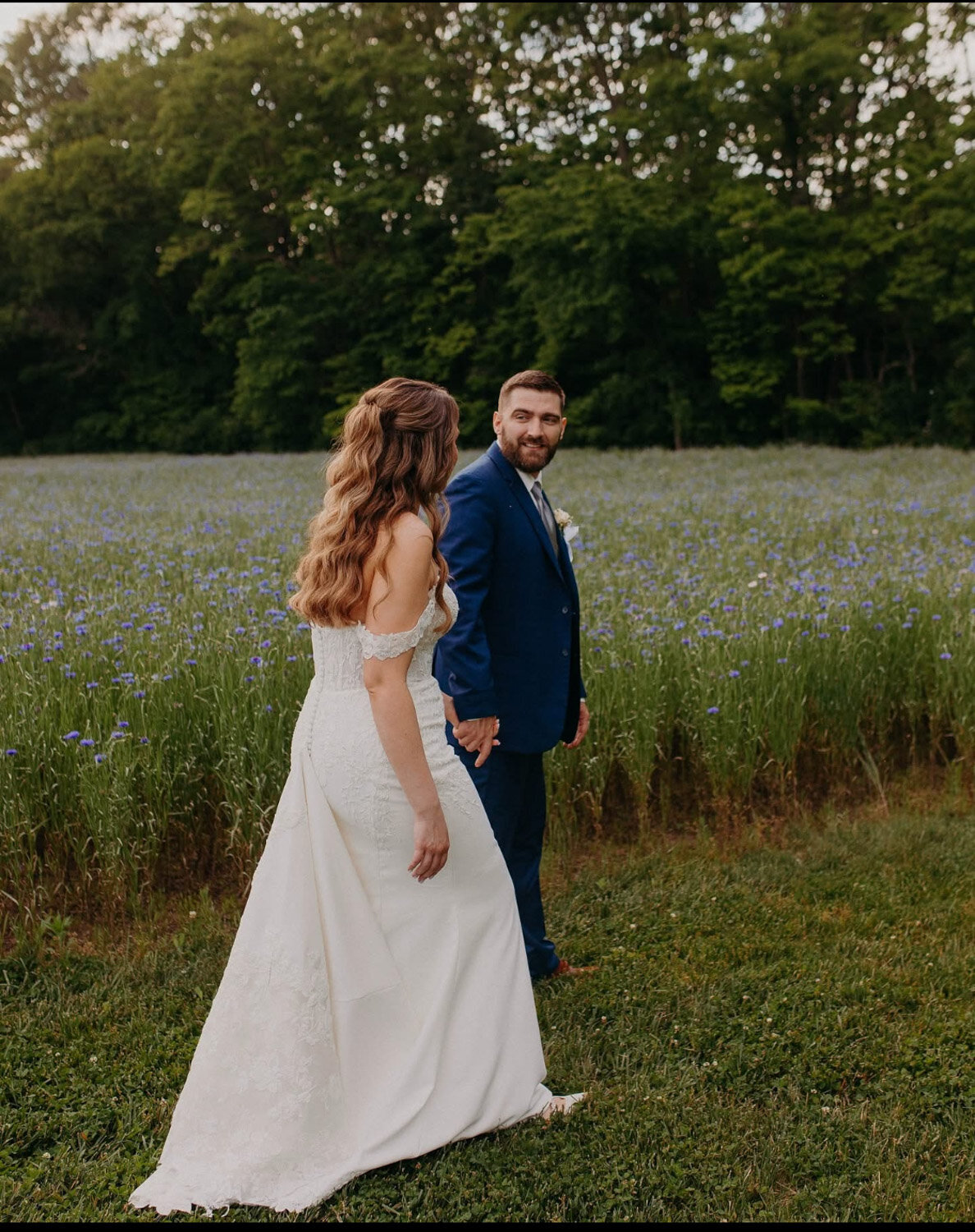 Bride and groom walking outside 