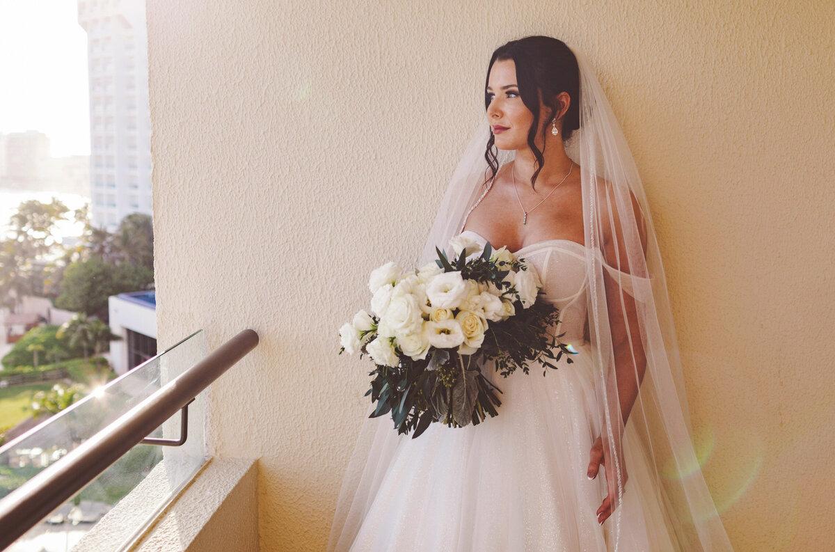 Portrait of bride on balcony at wedding in Cancun
