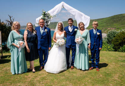 A group wedding photo after the wedding