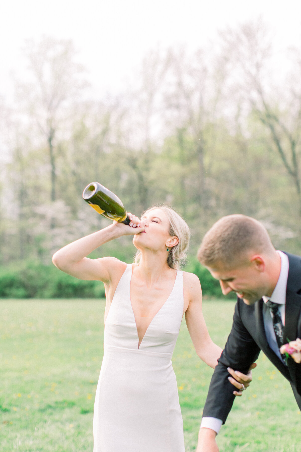 Bride drinking champagne in Ohio.