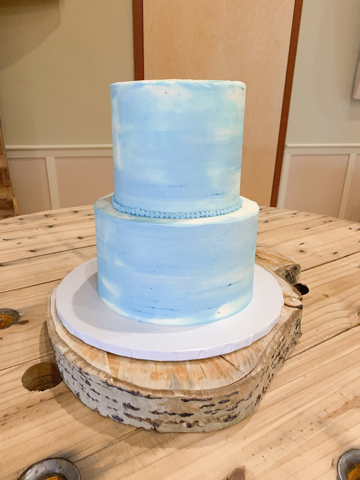 2-tiered blue wedding cake by Sweets By Sue in Lethbridge, Alberta, featured on the Brontë Bride Vendor Guide.