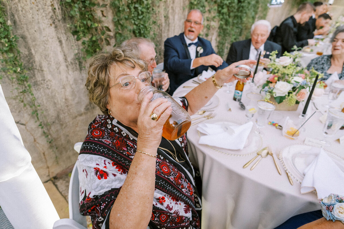 woman-drinking-moonshine-from-mason-jar