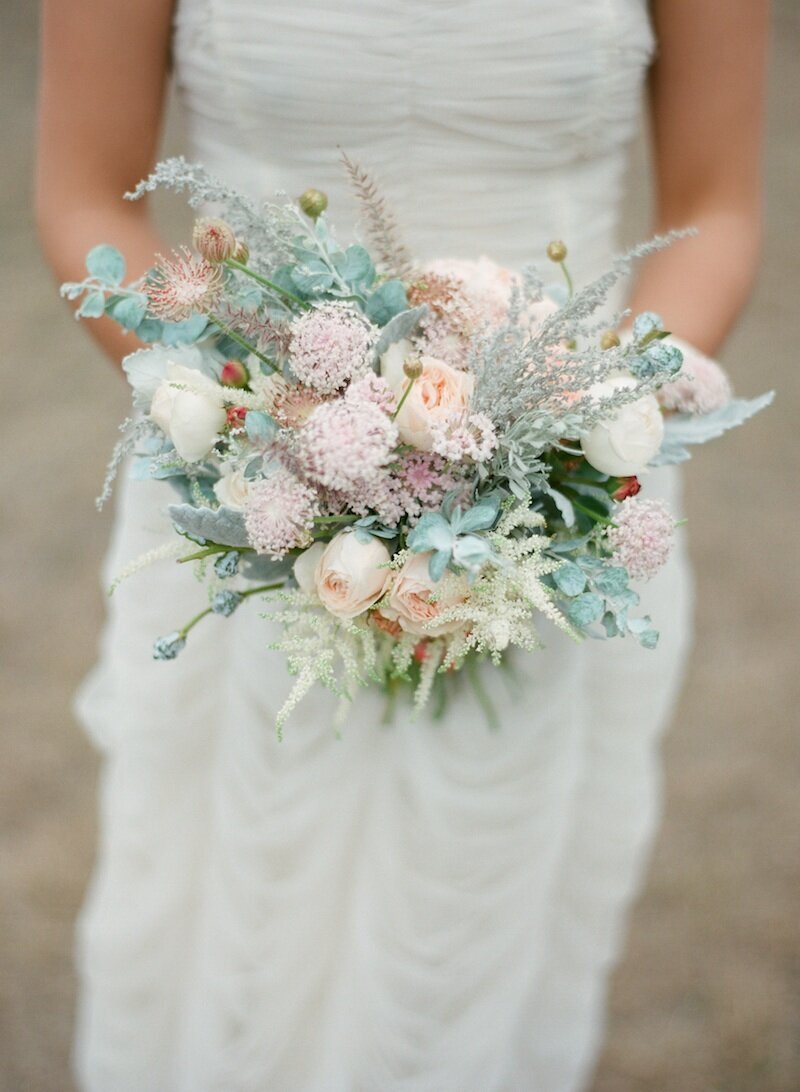 close up of bride peach and pink bouquet
