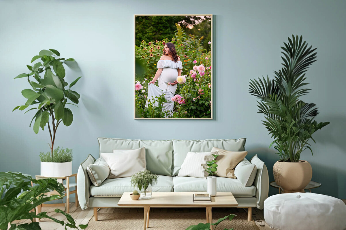 blue room with a framed photo of a pregnant woman for her outdoor Burlington, On Maternity photography session