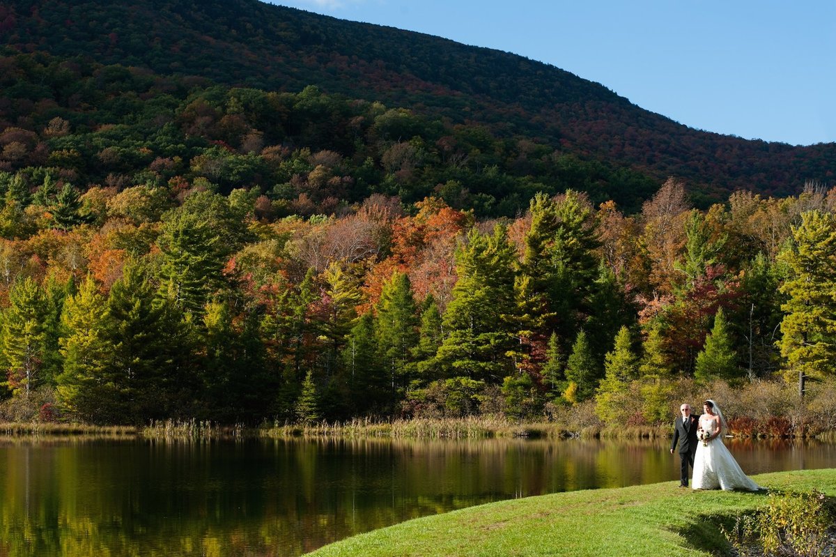 Fall wedding with foliage at the Equinox Inn - an outdoor wedding by the pond