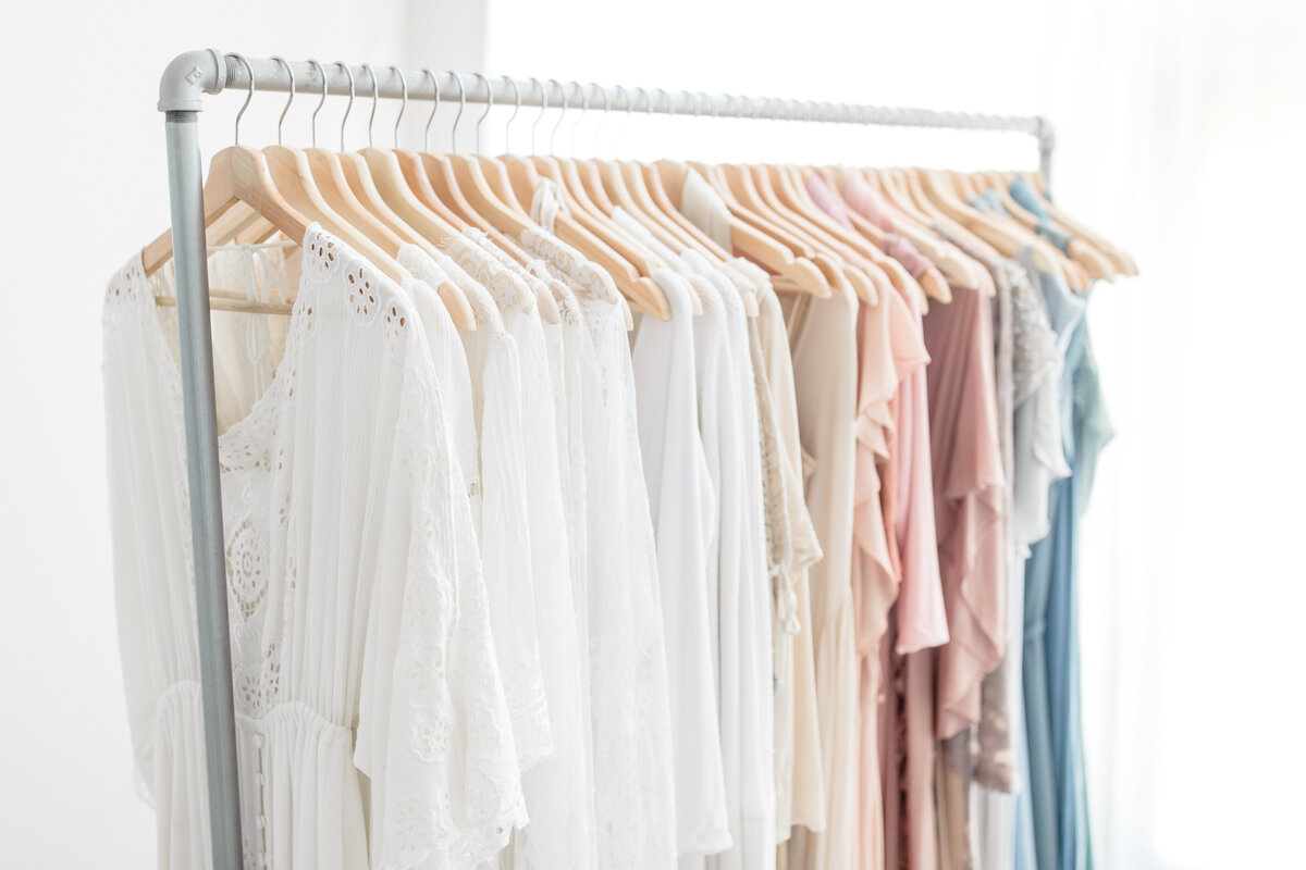 Client wardrobe dresses available for new mom with a newborn photo session at One Good Shot Photography in Fresno, CA