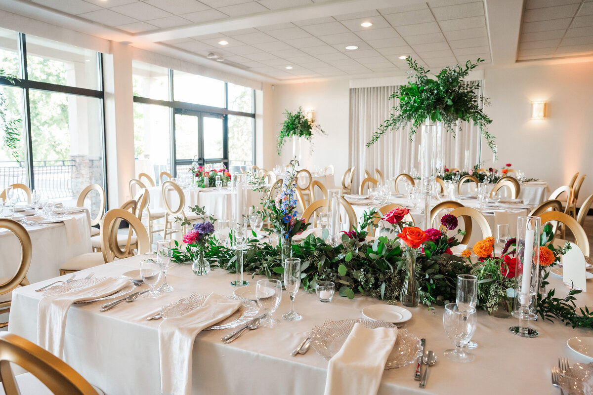 ballroom setup for a wedding at The Lake Club Ohio with high centerpieces