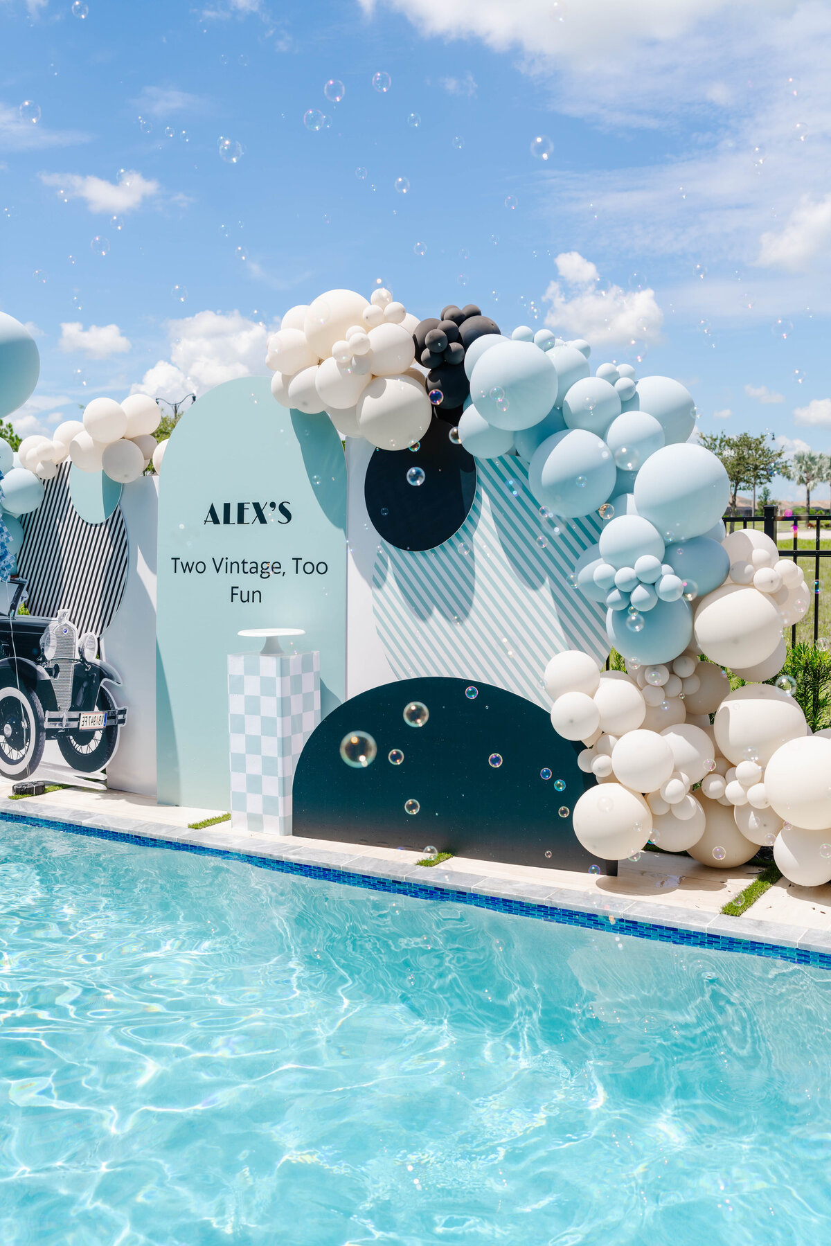 blue, taupe, black and white balloon arch and five foot backdrops