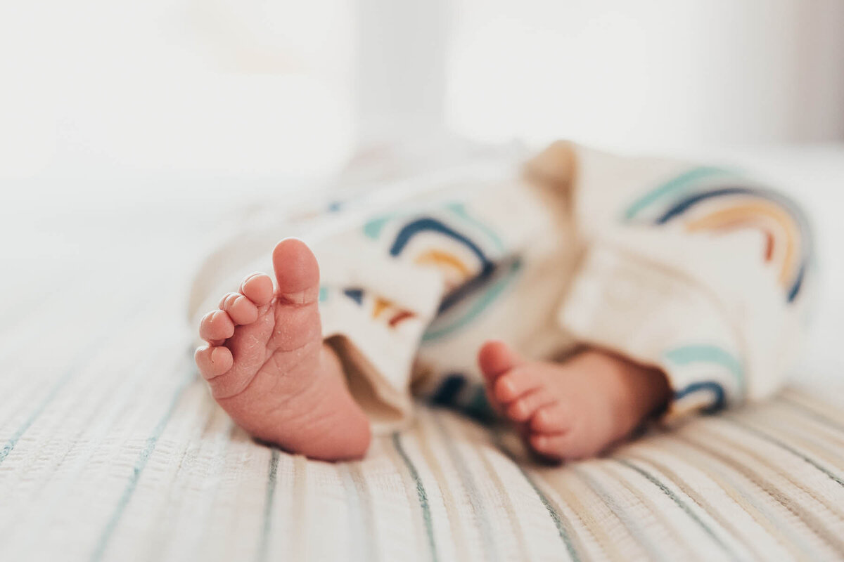 a close up of adorable baby feet taken during a newborn photography session in San Diego