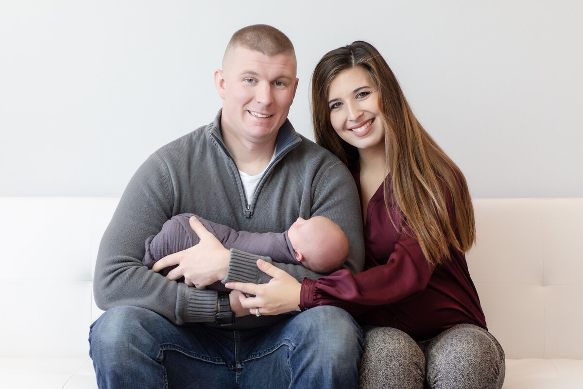 Family of three with newborn baby