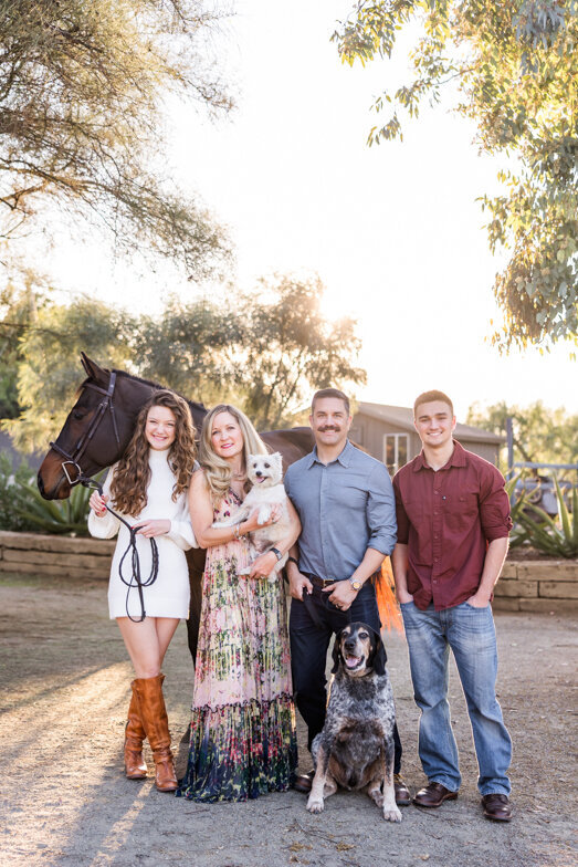 family of four with two dogs and a horse in Bonita San. Diego