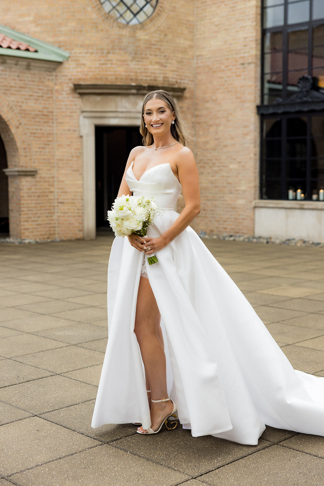 beautiful-bride-holding-flowers-revel-motor-row-HBICWeddings