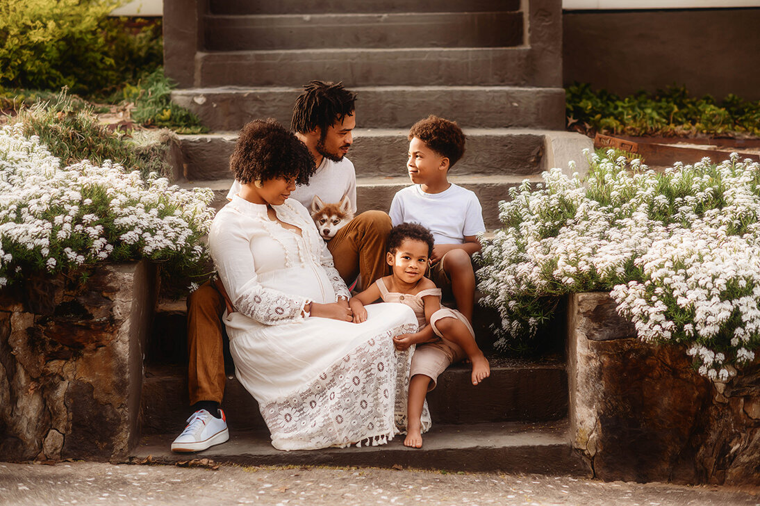 Family poses for portraits during family photos in Asheville.