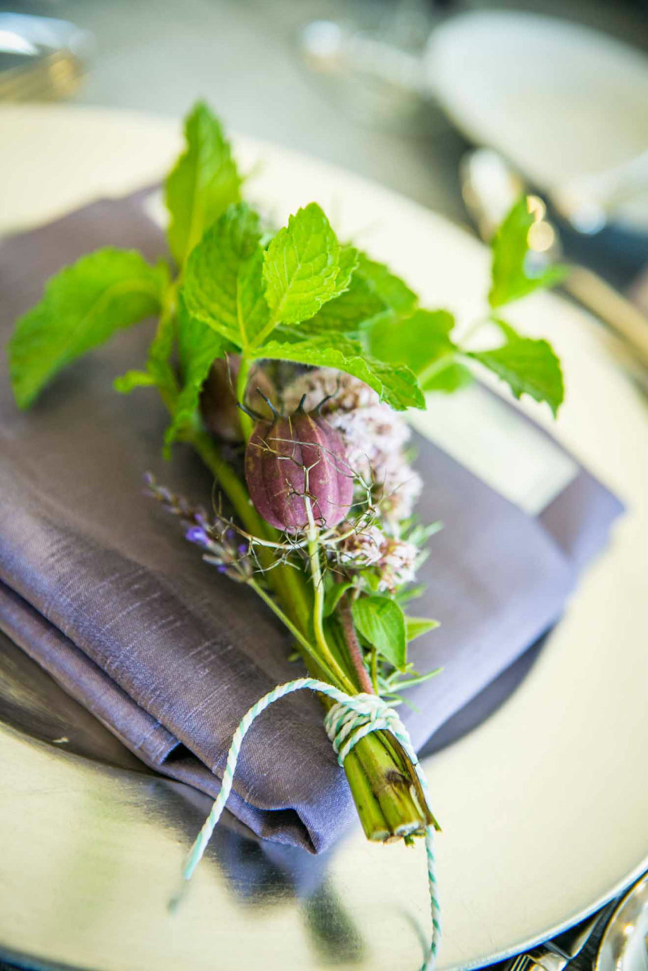 bundle of herbs for napkin at wedding