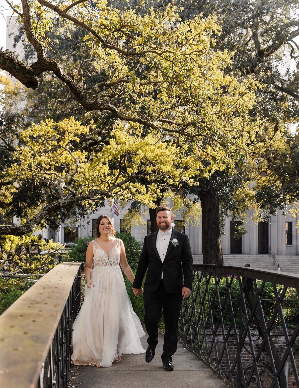 Bride Groom walking on bridge Savannah Georgia