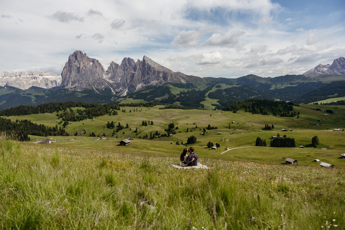 Intimate couple in Scenic Dolomites peaks Alpe di Siusi